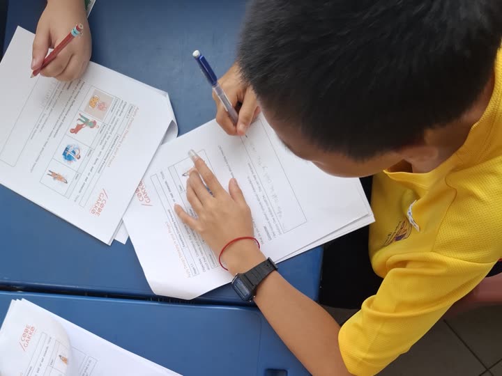 Students working through a Code Gakko worksheet.